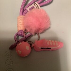 Pink shoe, soccer ball on purple lanyard keychain